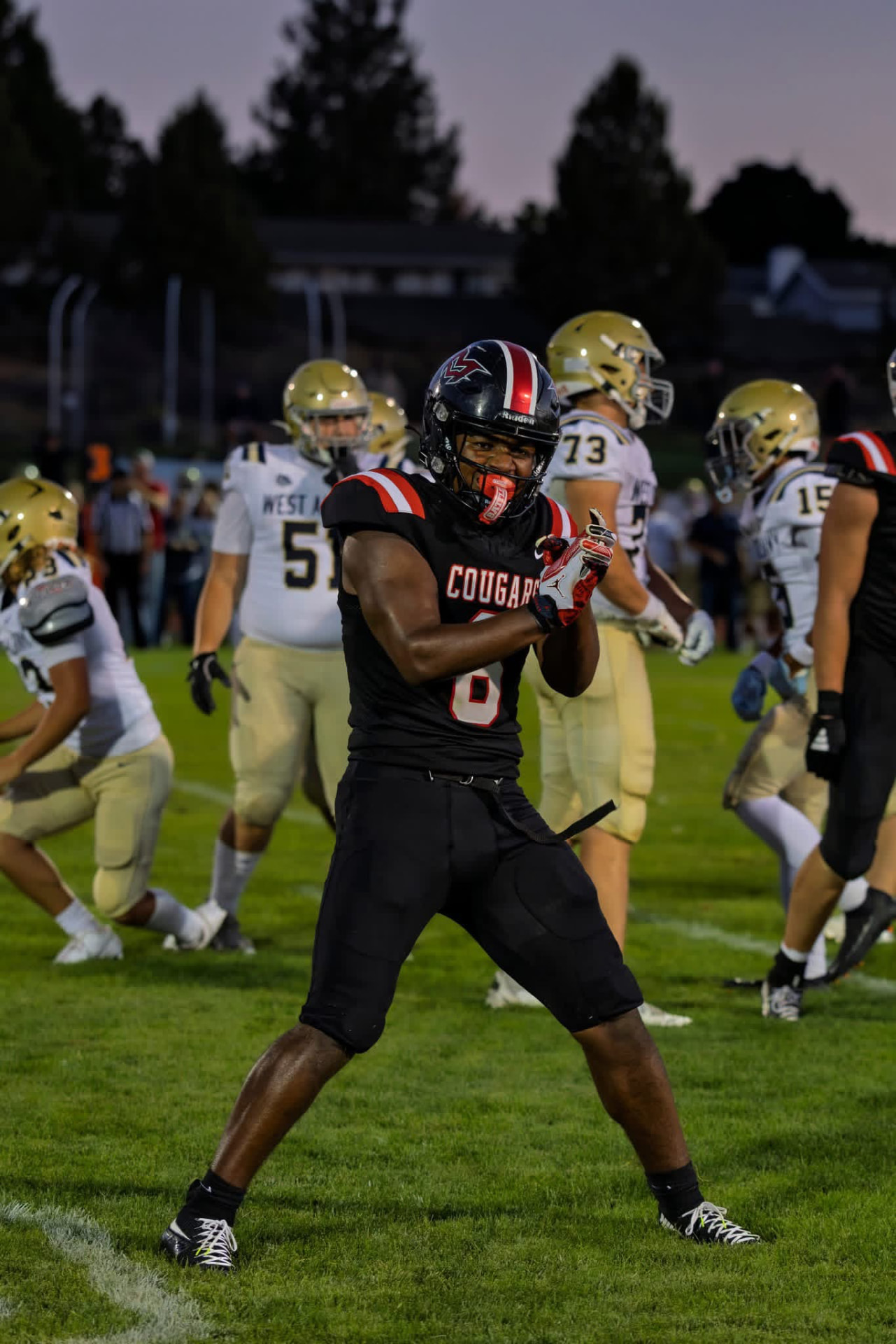 Cougars player celebrates on the field